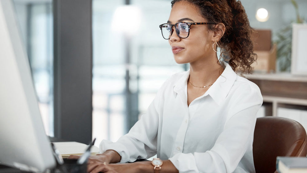 Woman working at her desk with good posture