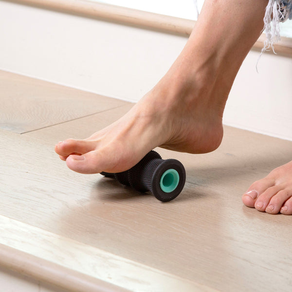 Person using Chirp Foot Roller