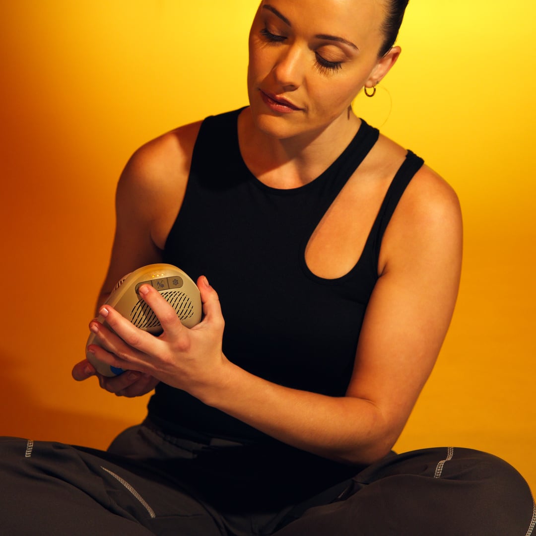 Woman sitting on the floor, holding Contrast
